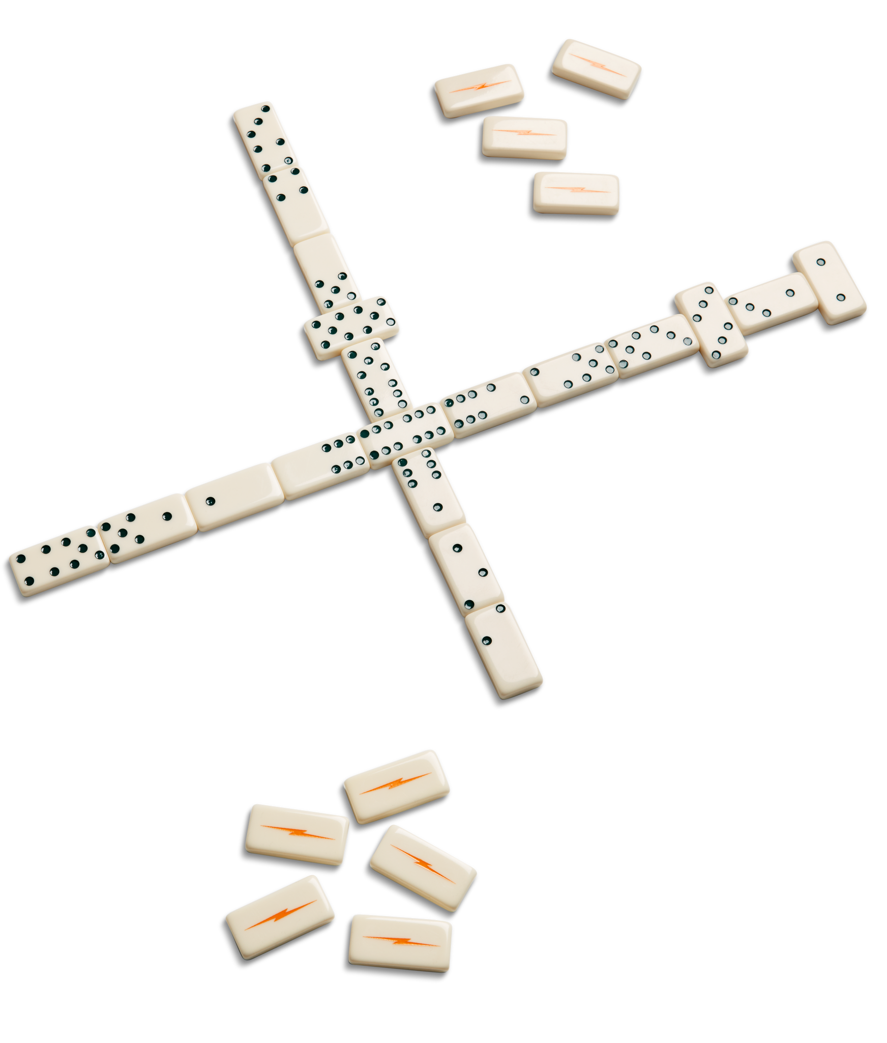 Dominoes arranged in a cross, with extra tiles nearby. Some show classic dots, others feature orange lightning bolts—part of the Shinola Dominoes Set - Cream / Blue.