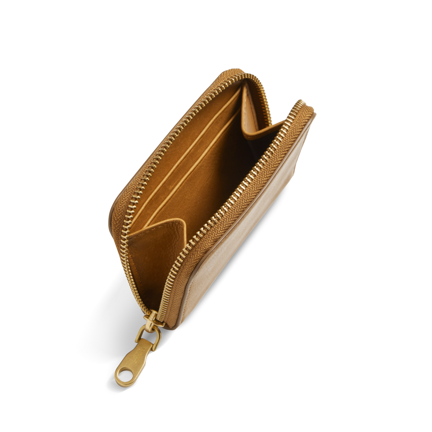 The Shinola Pocket Small Zip Around Wallet in tan natural leather features a gold zipper pull, interior card slots, and a center compartment. Shown open against a white background.