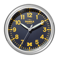 A 14" Shinola Runwell Clock with a silver frame, blue face, yellow numbers and hands. The clock reads 1:09:35, shows Shinola Detroit at the top, and has a yellow M for the University of Michigan at the bottom.
