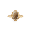 The Shinola Petite Diamond Pave Petoskey Oval Ring in yellow gold features a translucent brown Petoskey stone framed by a diamond halo and additional diamond pave accents on the band.