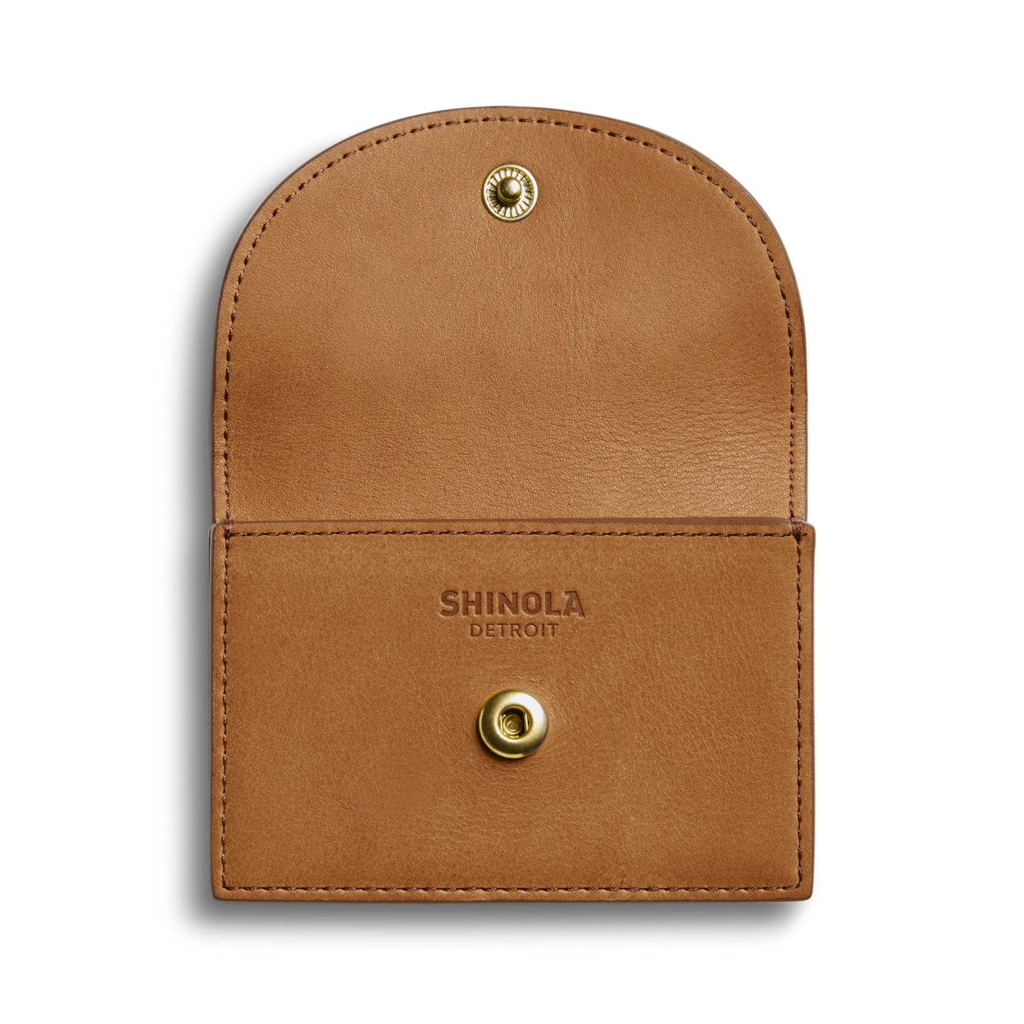 The Shinola Birdy Accordion Card Holder in tan natural leather features a flap with a gold snap button and "SHINOLA DETROIT" stamped inside. Its simple, minimal design makes it an elegant everyday wallet.