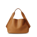 The Shinola Derby Shoulder Bag - Tan is a large tote with wide handles, a minimal unstructured silhouette, and a discreet leather card pocket, shown standing upright against a white background.