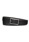 Shinola's 1 1/4" Reversible Rectangle Buckle Belt in black bridle leather features a sleek silver rectangular buckle, shown coiled on a white background—an ideal classic everyday accessory.