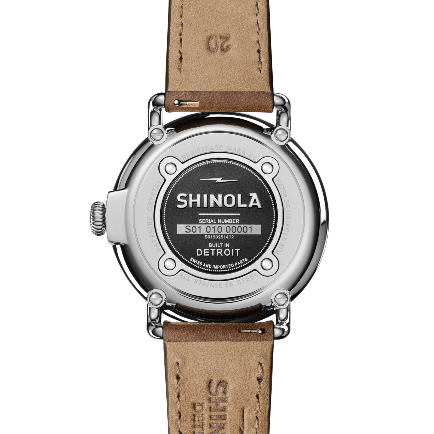 The back of the Shinola Runwell Watch - Ivory features a brown leather strap, with the brand logo, serial number, and "BUILT IN DETROIT" engraved on its stainless steel case.