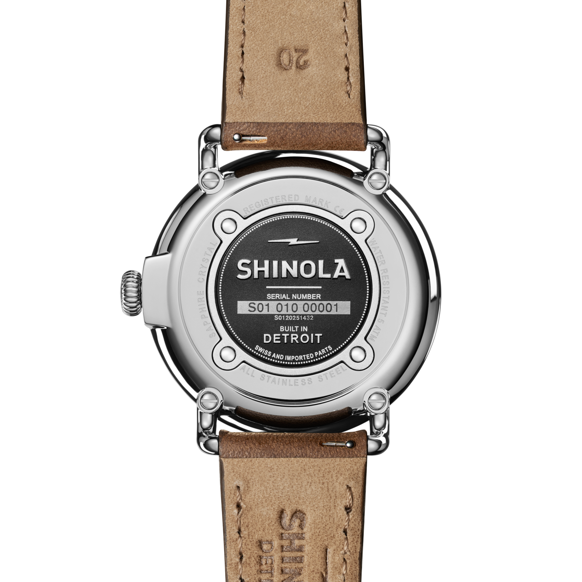 The back of the Shinola Runwell Watch - Ivory features a brown leather strap, with the brand logo, serial number, and "BUILT IN DETROIT" engraved on its stainless steel case.