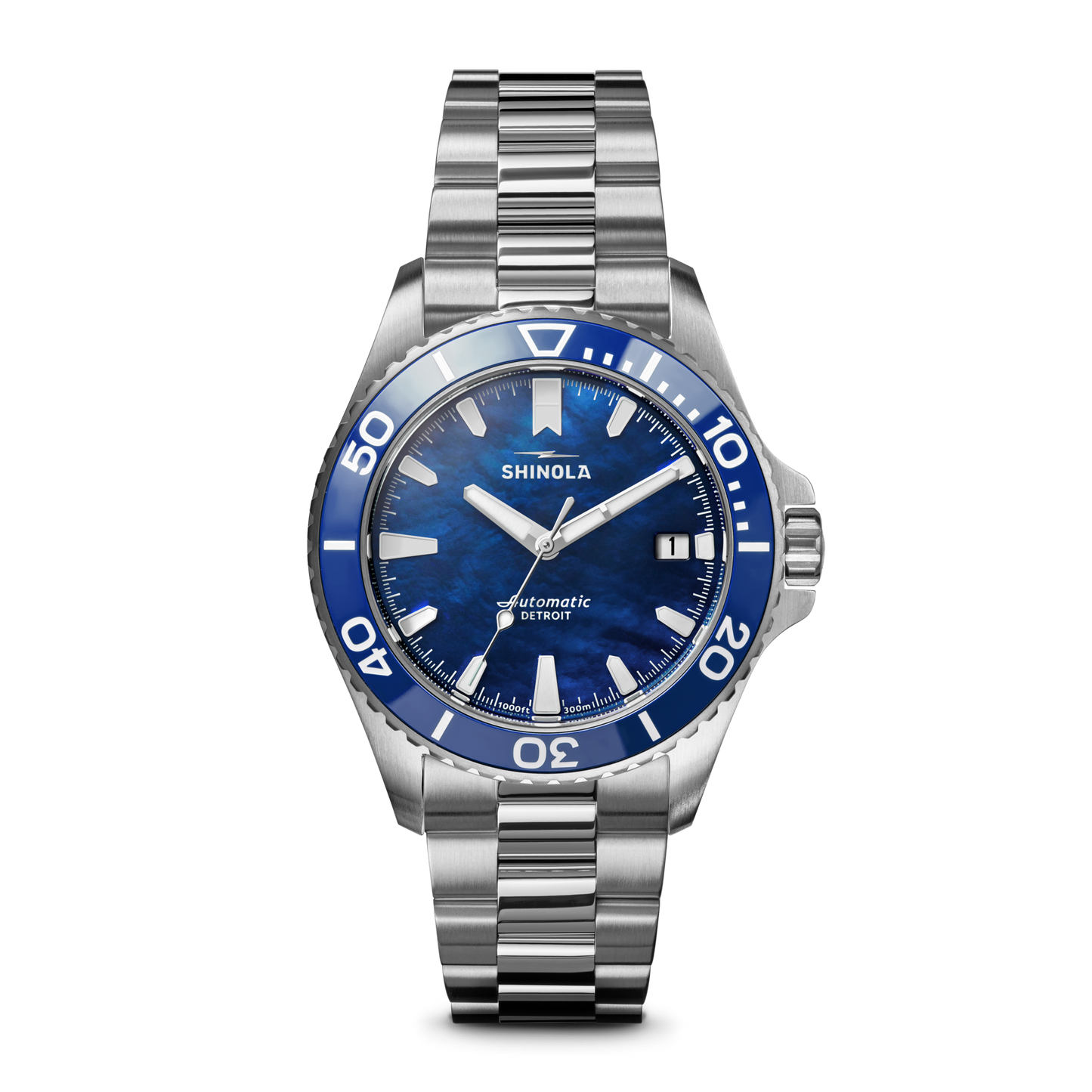 The Lake Michigan Monster Automatic Dive Watch by Shinola features a stainless steel case, blue and white dive bezel, blue dial, silver hour markers, date window at 3 o’clock, and showcases the Shinola brand on its automatic movement.