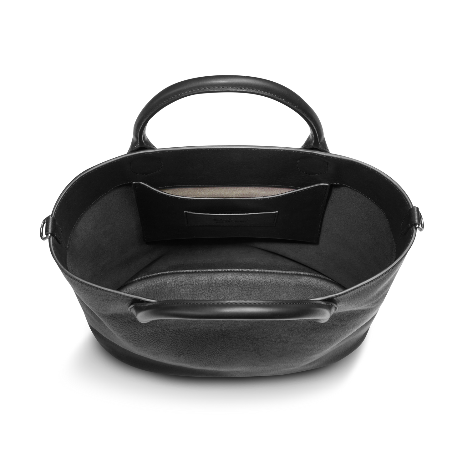 The Shinola 12 Hour Tote Bag - Black features two handles, a spacious open interior, and a small side pocket. This minimalist leather handbag is empty—ideal as your everyday go-to bag.
