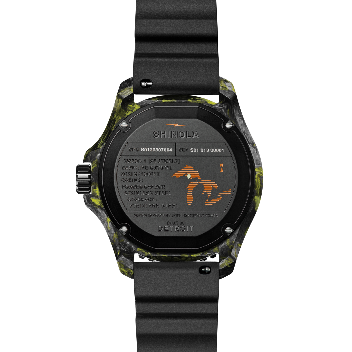 The back of the Shinola Forged Carbon Monster Watch features a forged carbon case with black and yellow patterns, a black strap, engraved specs like water resistance, stainless steel, a map outline, “Built in Detroit,” and a Swiss-made automatic movement.
