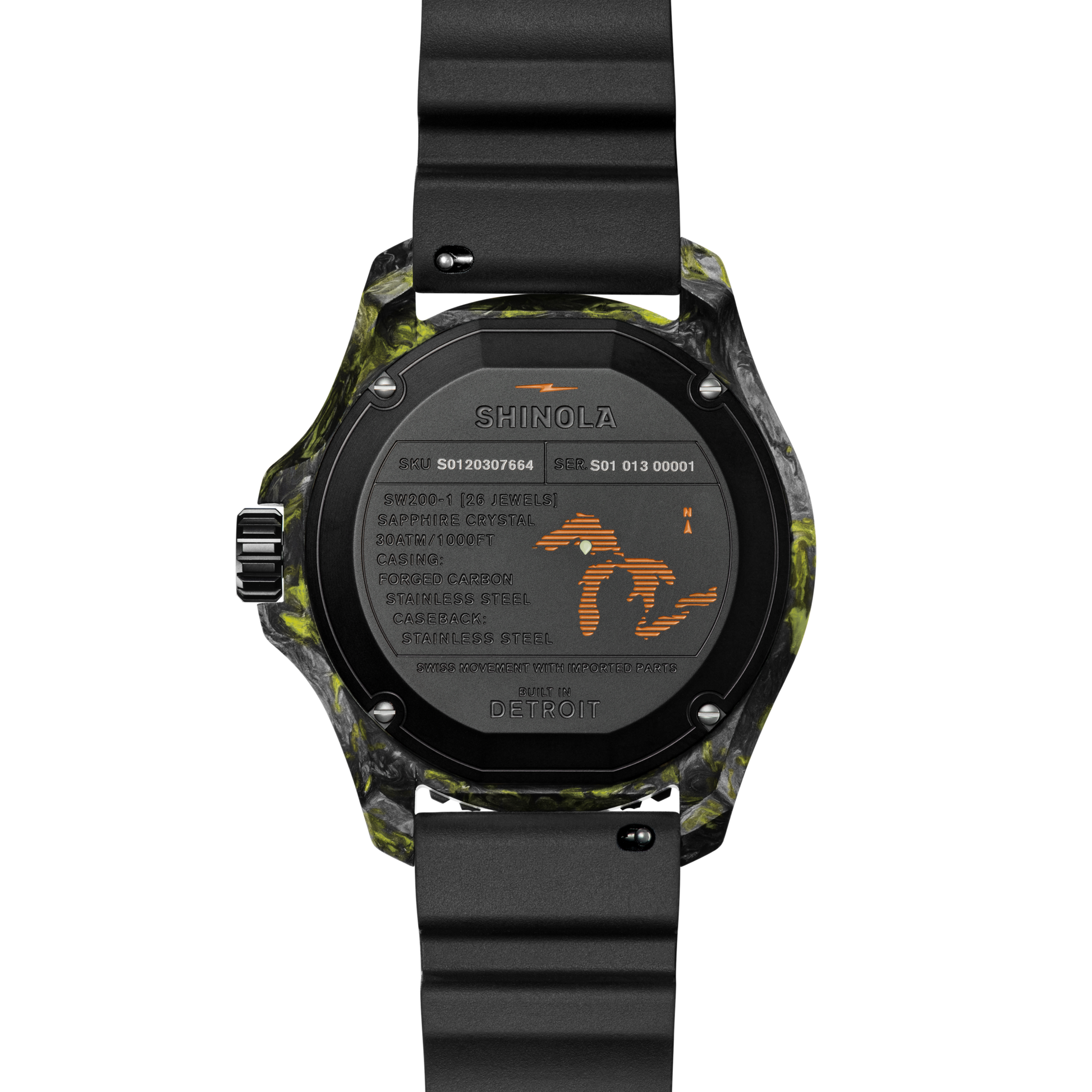 The back of the Shinola Forged Carbon Monster Watch features a forged carbon case with black and yellow patterns, a black strap, engraved specs like water resistance, stainless steel, a map outline, “Built in Detroit,” and a Swiss-made automatic movement.