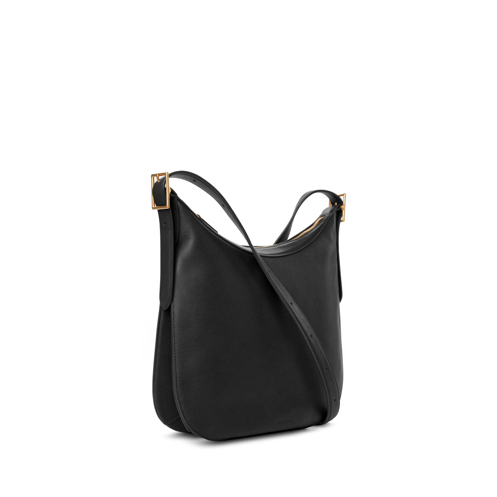 The Medium Bixby Crossbody - Black by Shinola is a minimalist natural leather shoulder bag with dual slim straps and gold-tone rectangular buckles, shown on a plain white background for versatile styling.