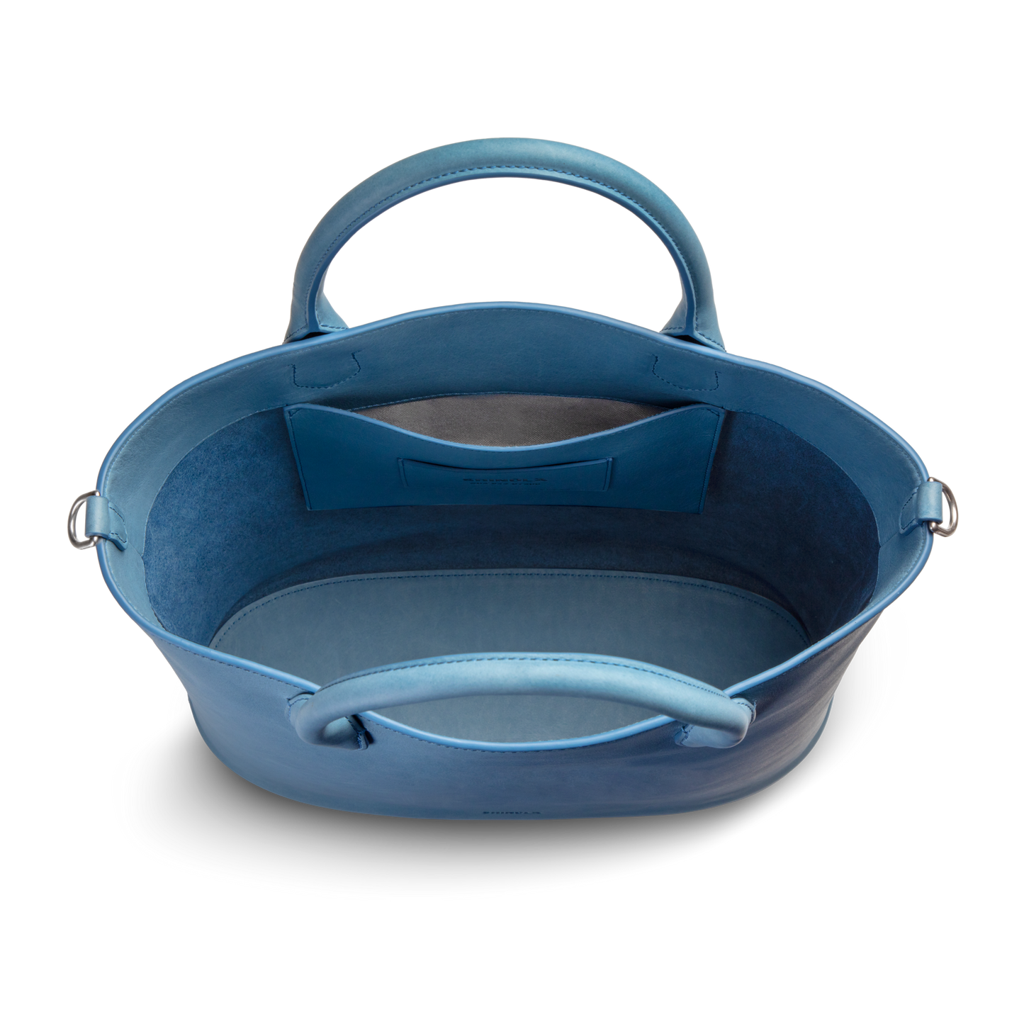 The Shinola 12 Hour Tote Bag - River is an open-top blue natural leather tote with two handles, a roomy interior, and an inner slip pocket—ideal for daily use—all elegantly set against a plain white background.