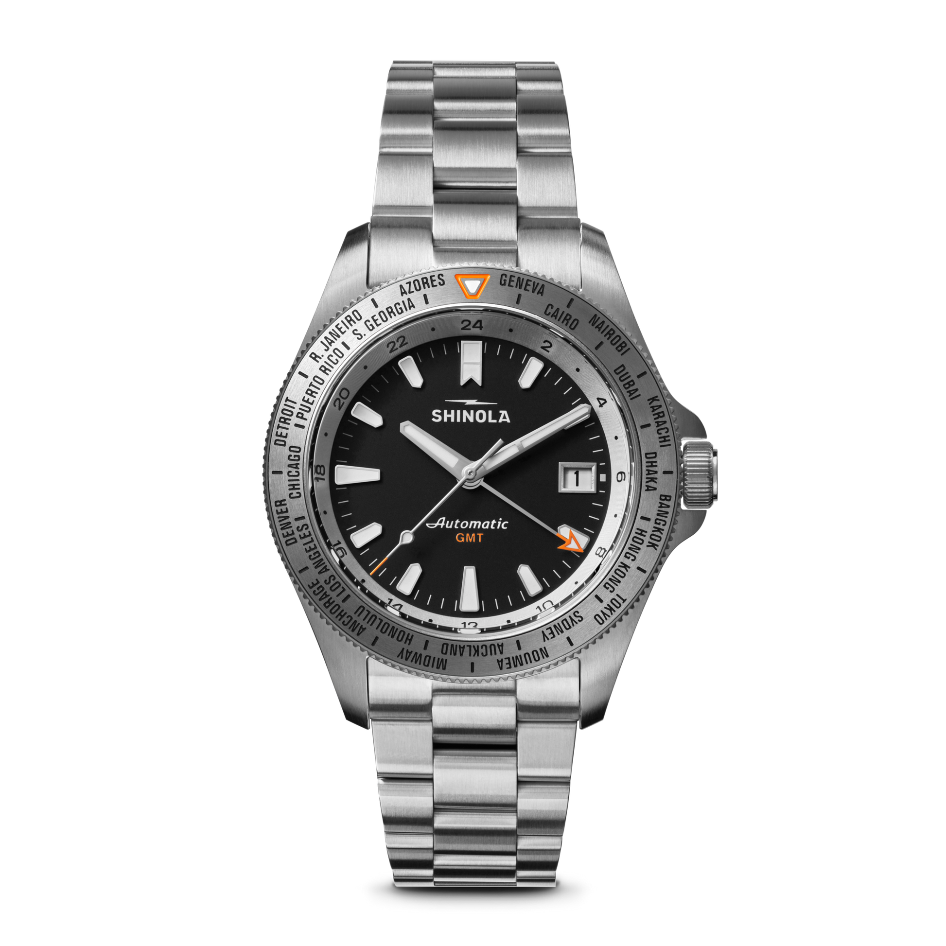 The Shinola Monster Worldtimer GMT Watch features a black dial, silver hour markers, date window at 3 o’clock, world timer bezel with cities, orange GMT hand, and a metal link band—perfect for travelers.