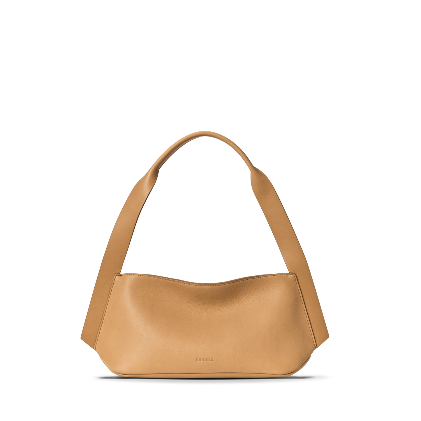 The Small Derby Shoulder Bag - Honey by Shinola features natural leather in a petite, curved silhouette with a wide strap and minimal design, subtly embossed with the Shinola logo near the bottom center against a white background.
