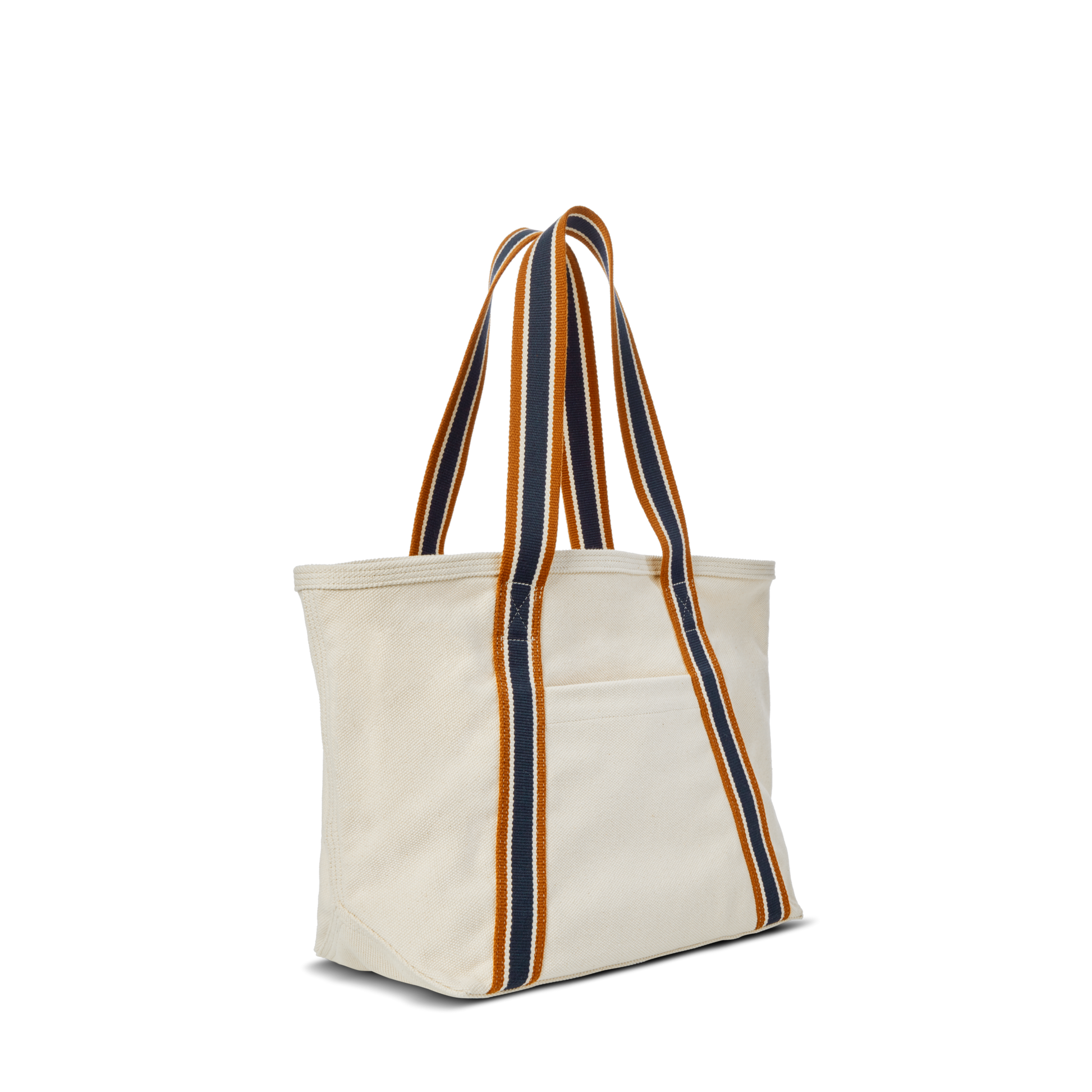 The Small Easy Canvas Tote - Natural by Shinola is a compact cream tote with wide, striped navy, gold, and orange straps plus a front pocket—perfect for everyday essentials against a crisp white canvas.