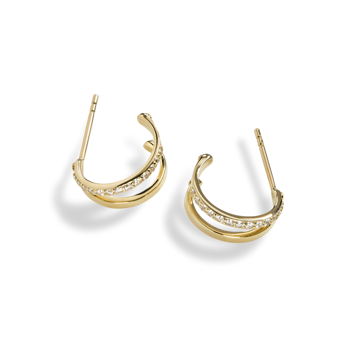 The Shinola Diamond Rivet Huggies are small 14k yellow gold hoops with a double band—one smooth, one set with brilliant cut diamonds—shown on a plain white background.