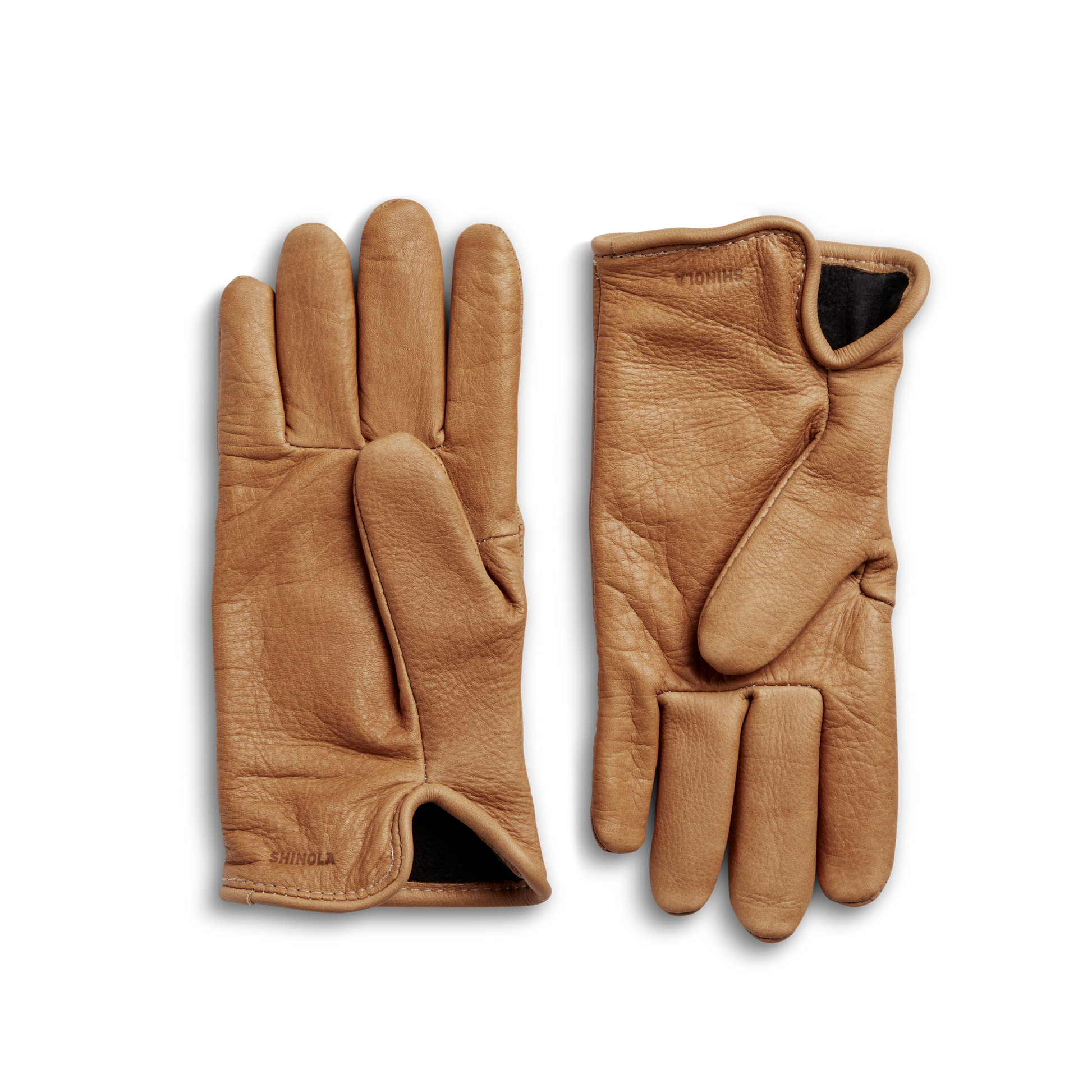 A pair of Shinola Lined Leather Gloves in black is displayed on a white background, with one glove showing the palm and the other the back. Expertly sewn in the USA, these fleece-lined gloves offer comfort and durability.