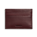 The Pocket Card Holder - Merlot by Shinola is a slim, rectangular dark brown vachetta leather card holder with two card slots and SHINOLA embossed at the bottom center.
