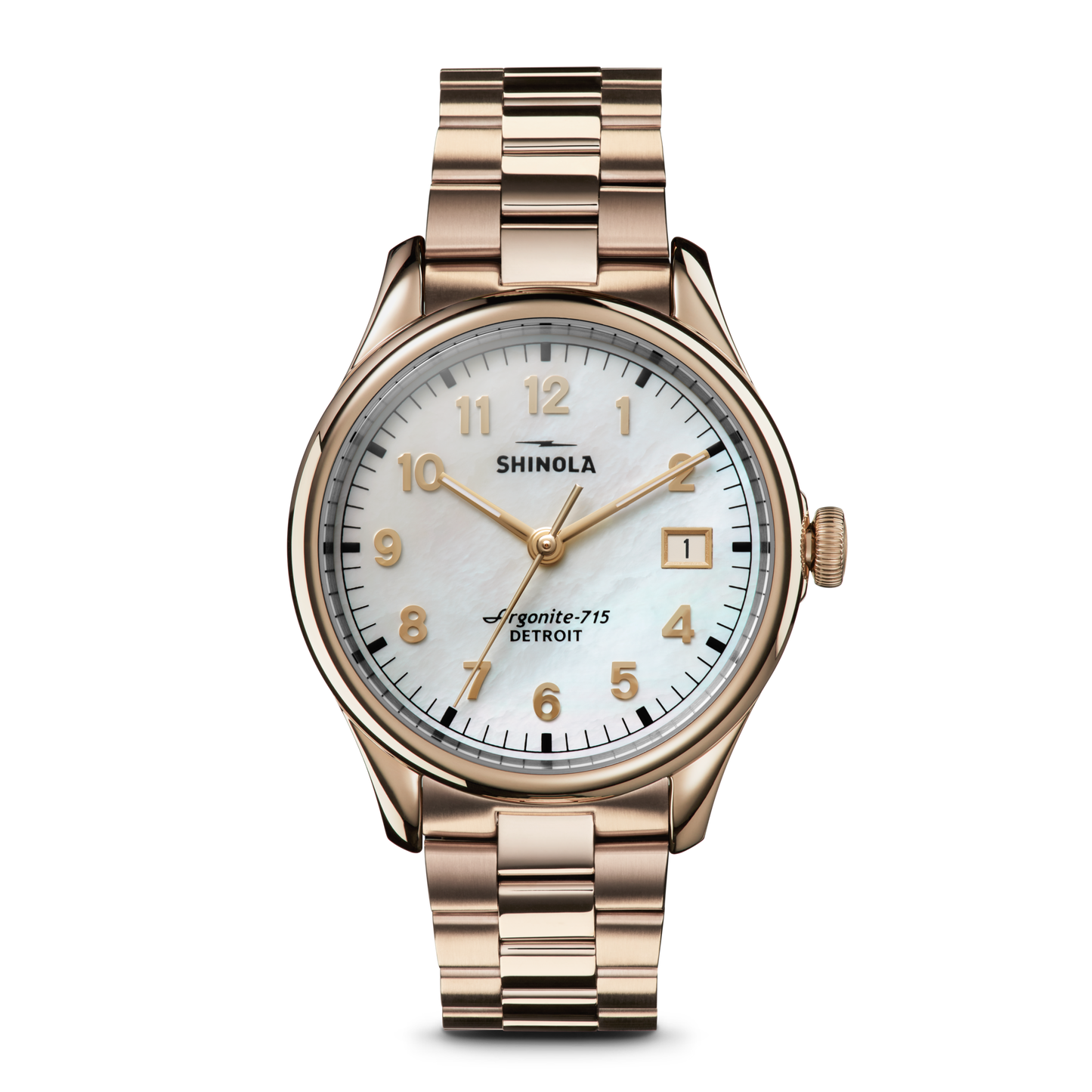 The Shinola Vinton Watch features a gold metal link band, white mother-of-pearl dial, gold hour markers and hands, date window at 3 o’clock, and “Shinola” plus “Argonite-715 Detroit” on the face—a statement of modern sophistication.