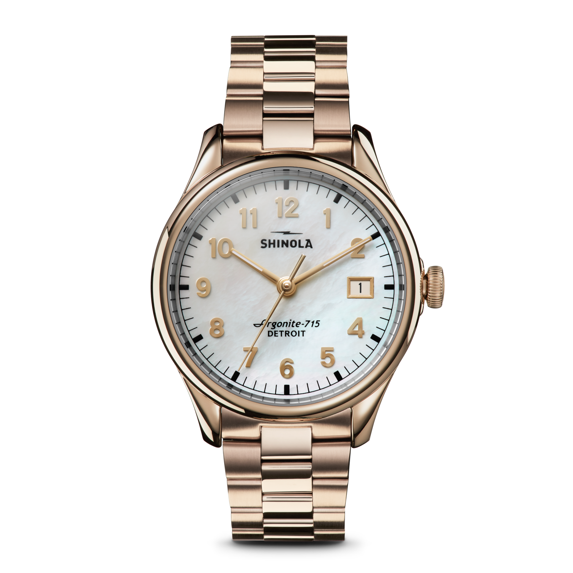 The Shinola Vinton Watch features a gold metal link band, white mother-of-pearl dial, gold hour markers and hands, date window at 3 o’clock, and “Shinola” plus “Argonite-715 Detroit” on the face—a statement of modern sophistication.