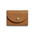 The Shinola Birdy Accordion Card Holder in tan natural leather features a curved flap with a single gold button snap, displayed against a plain white background.