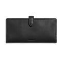 Crafted from natural leather, the Shinola Continental Snap Wallet - Black features a snap closure strap and an embossed brand name on the front, shown against a plain white background.