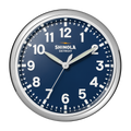 The 14" Runwell Clock - Navy by Shinola features a round silver frame, matte navy dial, and white numerals reading 1:50:35. "Shinola Detroit" appears below 12 o’clock, representing its signature wall clock style.