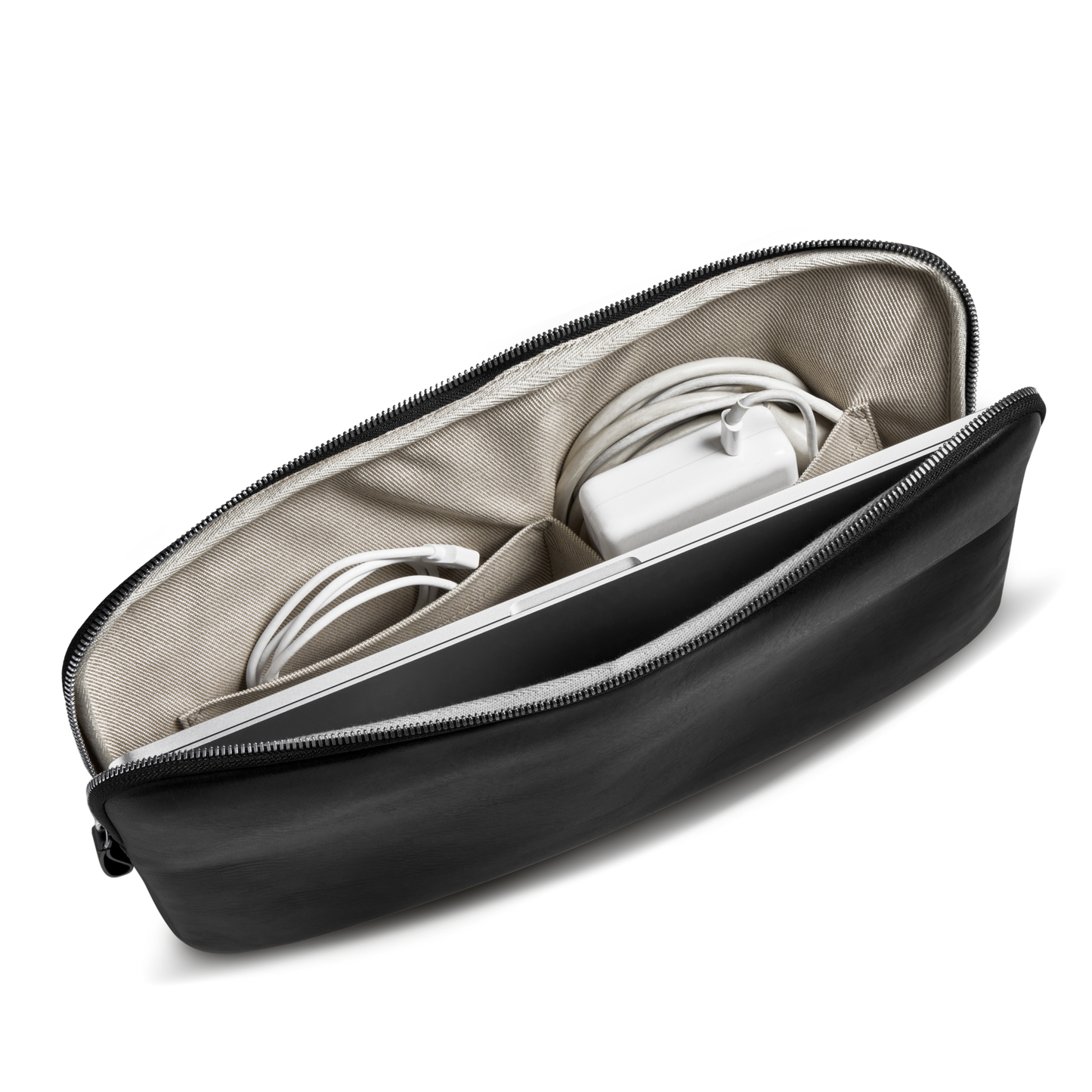 The Shinola Laptop Tech Case - Black features a beige interior and separate compartments to neatly organize a coiled charging cable, white power adapter, and other small electronic accessories.