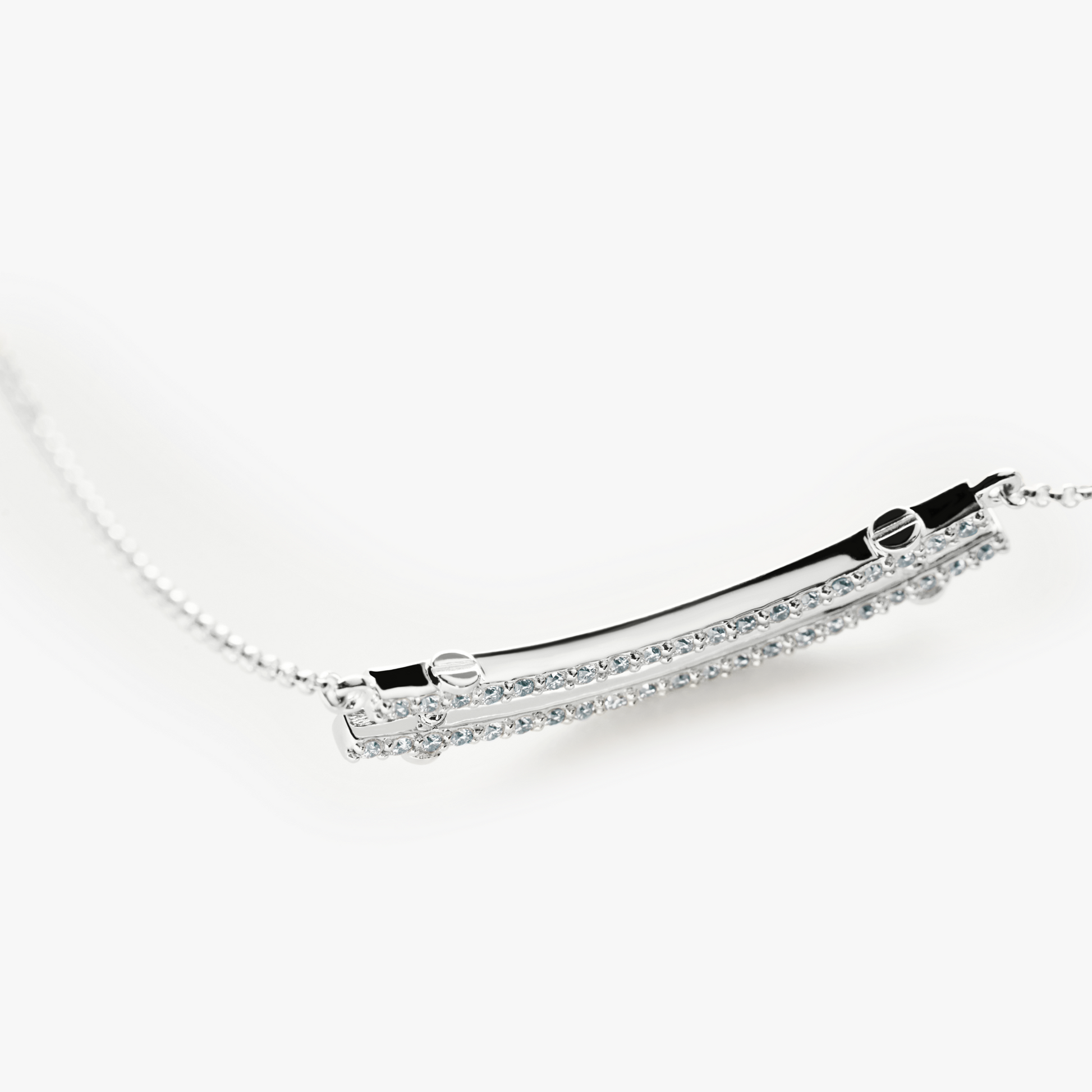 A close-up of the Shinola Diamond Pave Rivet Double Row Necklace in white gold, featuring a curved bar pendant with sparkling diamonds from the Rivet Collection, set against a plain white background.