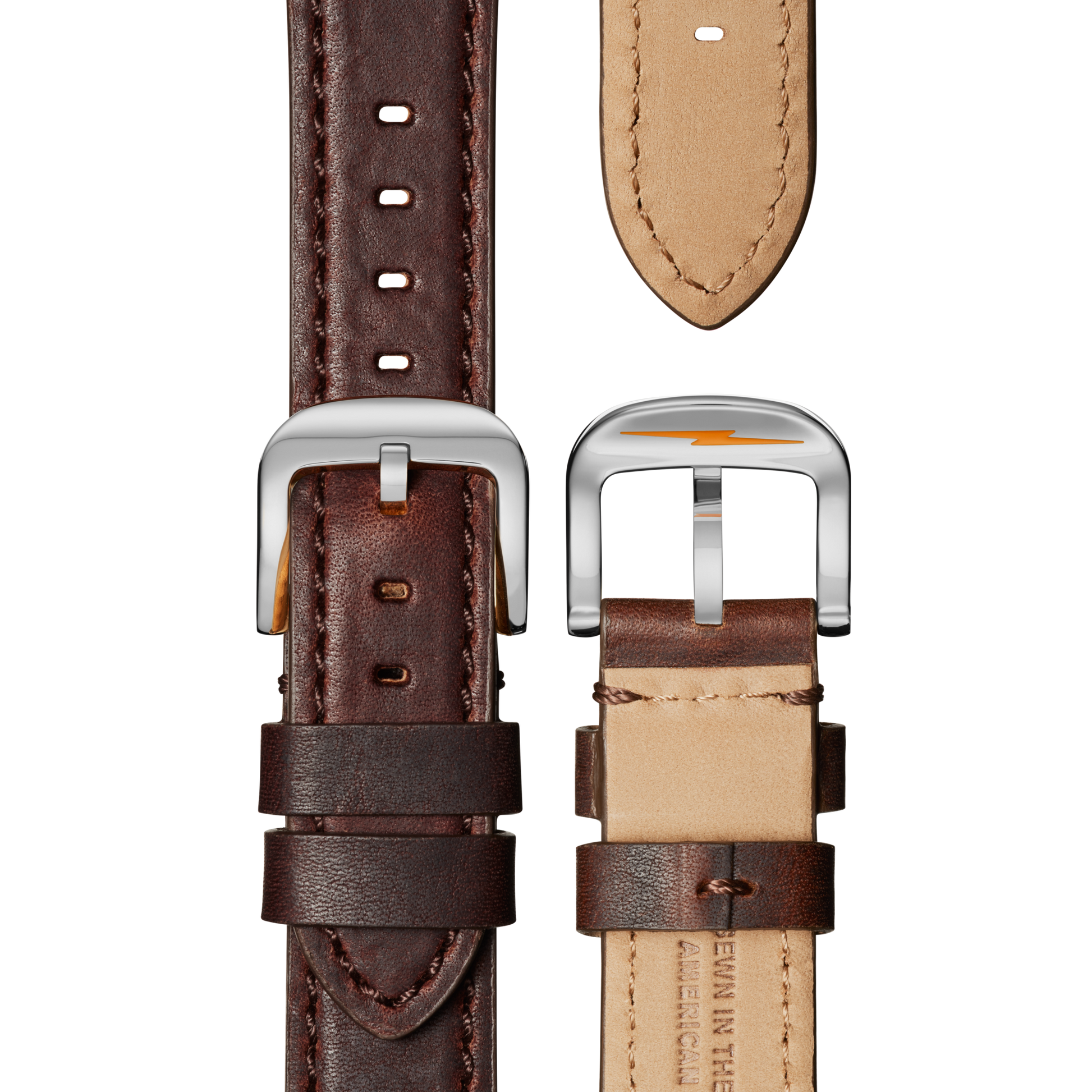 Close-up of two Shinola Canfield Chronograph Watch Cattail leather straps, one facing up and one down, showing dark brown exteriors, light beige interiors, stitched edges, shiny silver buckles, and elegant top loaded case construction.
