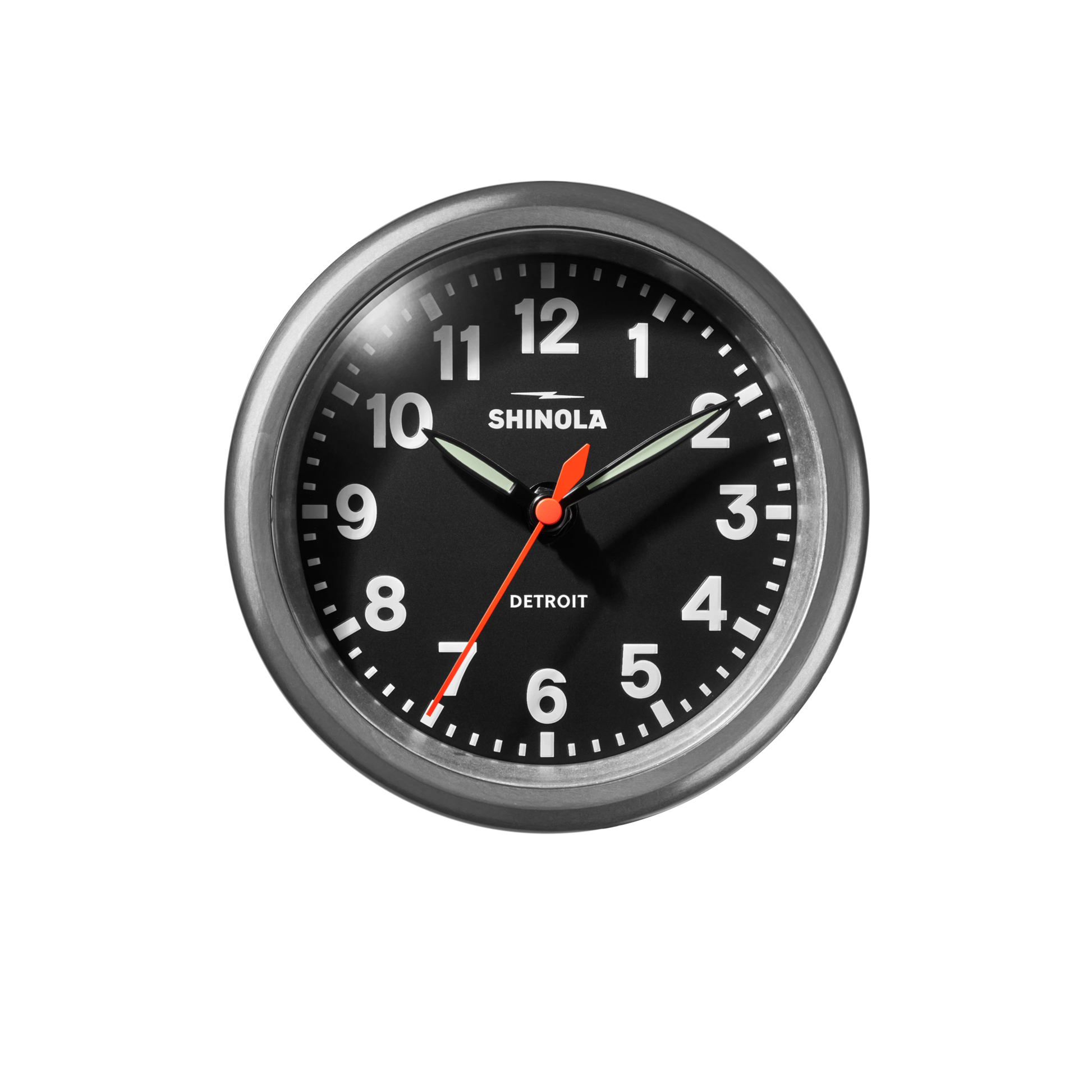 The Shinola 6" Runwell Clock has a tumbled zinc frame, black face with white numbers, and displays 10:09:36. The Shinola brand name appears prominently on the clock’s industrial-style face.