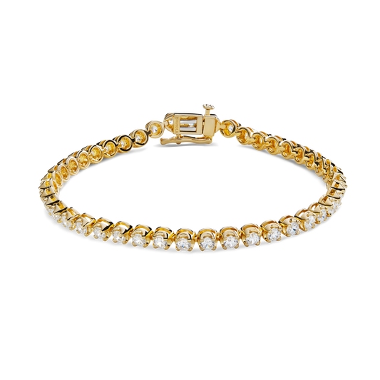 The Shinola 4 Carat 7" Diamond Tennis Bracelet in yellow gold features round, brilliant cut diamonds in prong settings and a box clasp, displayed against a plain white background.