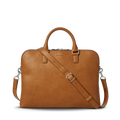 The Portfolio Briefcase - Tan by Shinola features top handles, a detachable shoulder strap, silver hardware, and an embossed logo on tan European leather. This slim laptop briefcase is showcased against a plain white background.