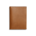 The Shinola Passport Holder - Tan is a rectangular Italian leather travel accessory with white edge stitching, shown closed against a plain white background.
