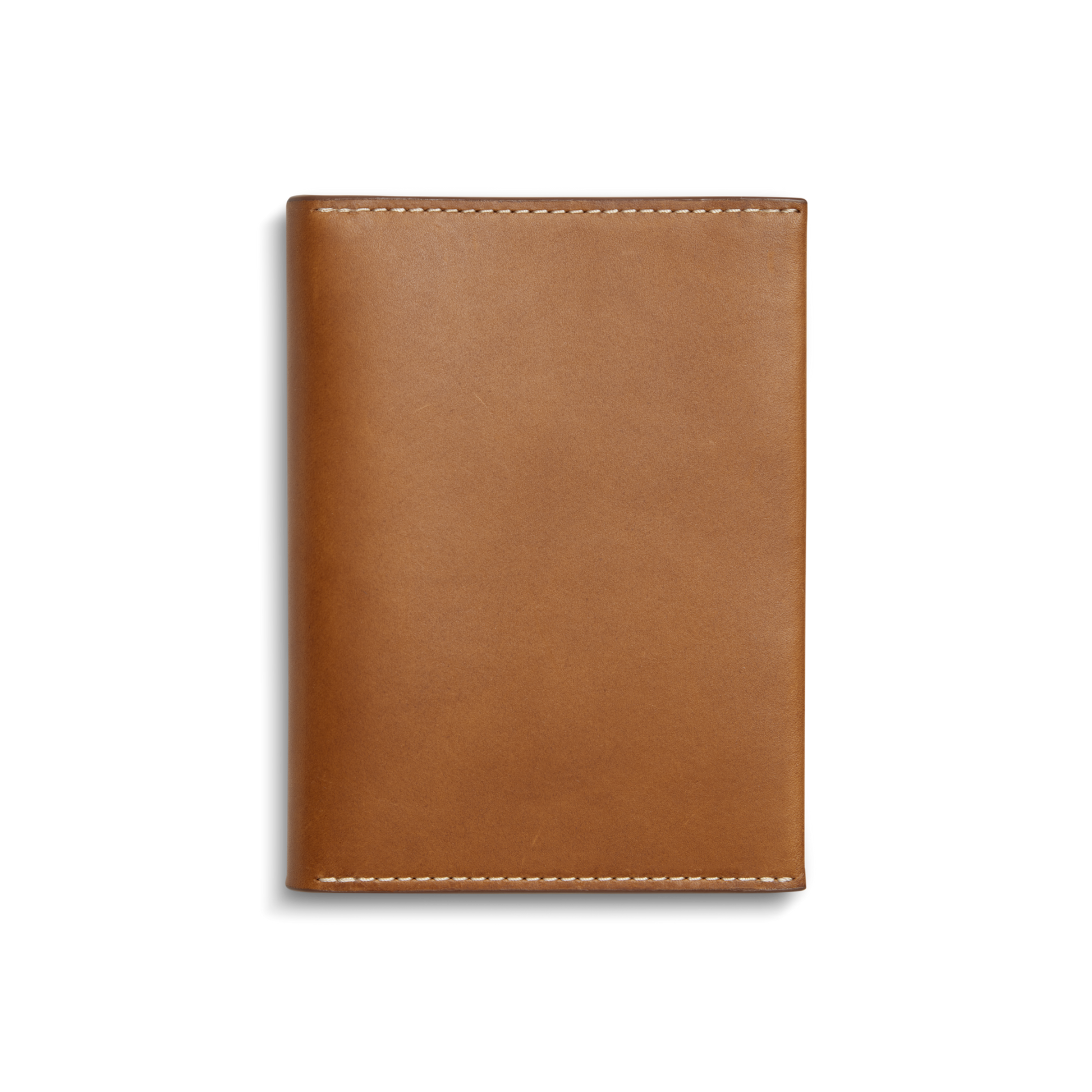 The Shinola Passport Holder - Tan is a rectangular Italian leather travel accessory with white edge stitching, shown closed against a plain white background.