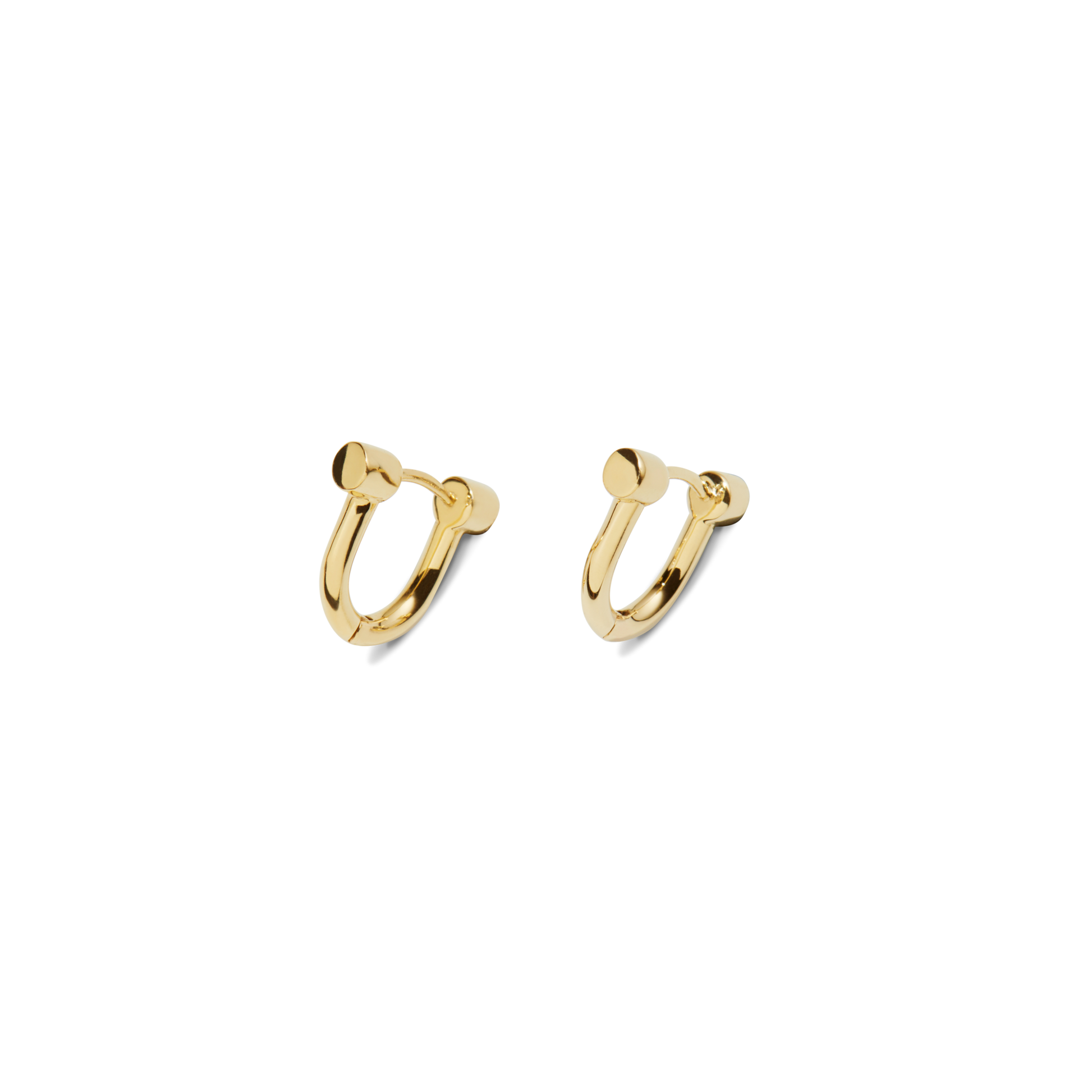 The Shinola Bike Lock Huggie Earrings in yellow gold feature a minimalist, bike lock-inspired design with smooth cylindrical ends—perfect for everyday wear. Shown on a plain white background.