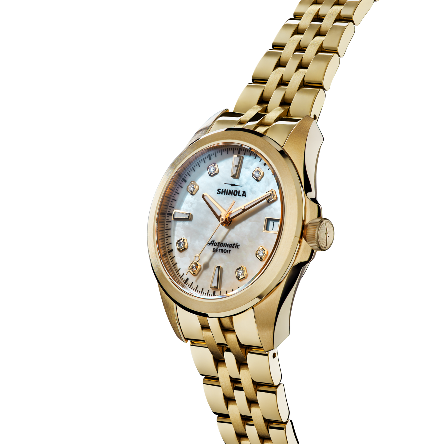 The Shinola Circadian Monster Automatic Watch - Mother of Pearl Diamond features a gold case, metal link band, white mother-of-pearl dial, gold hour markers, and diamond accents, shown at an angle on a white background.