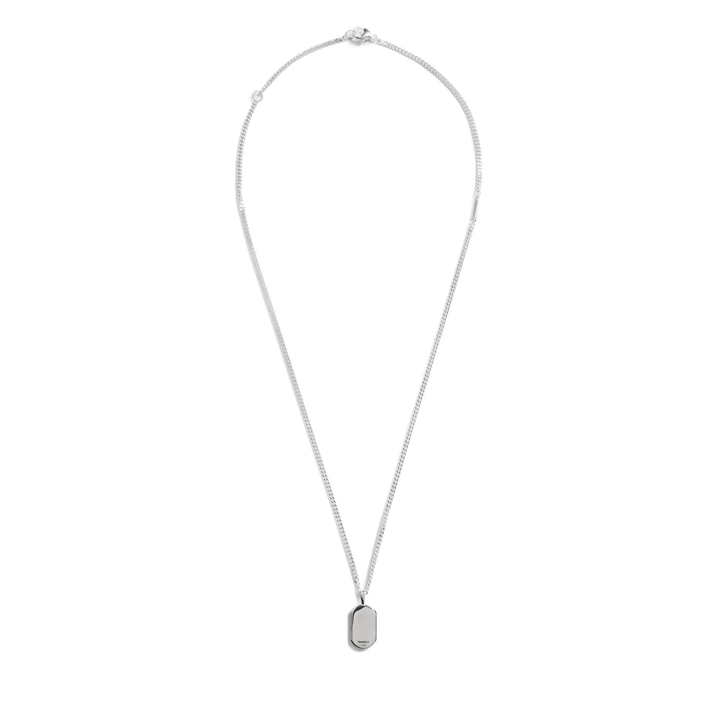 The Shinola Black Diamond Pave Tag Necklace features a thin adjustable curb chain and a small rectangular pendant, displayed on a white background.