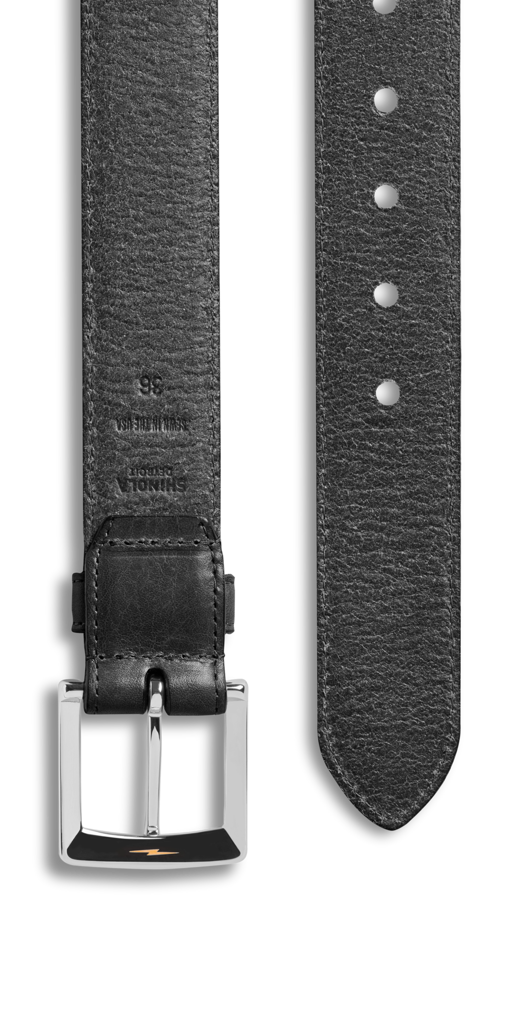 Close-up of the Shinola 1 1/2" Bedrock Belt in black signature leather, shown on a white background with a shiny silver hardware buckle on the left and multiple adjustment holes on the right.
