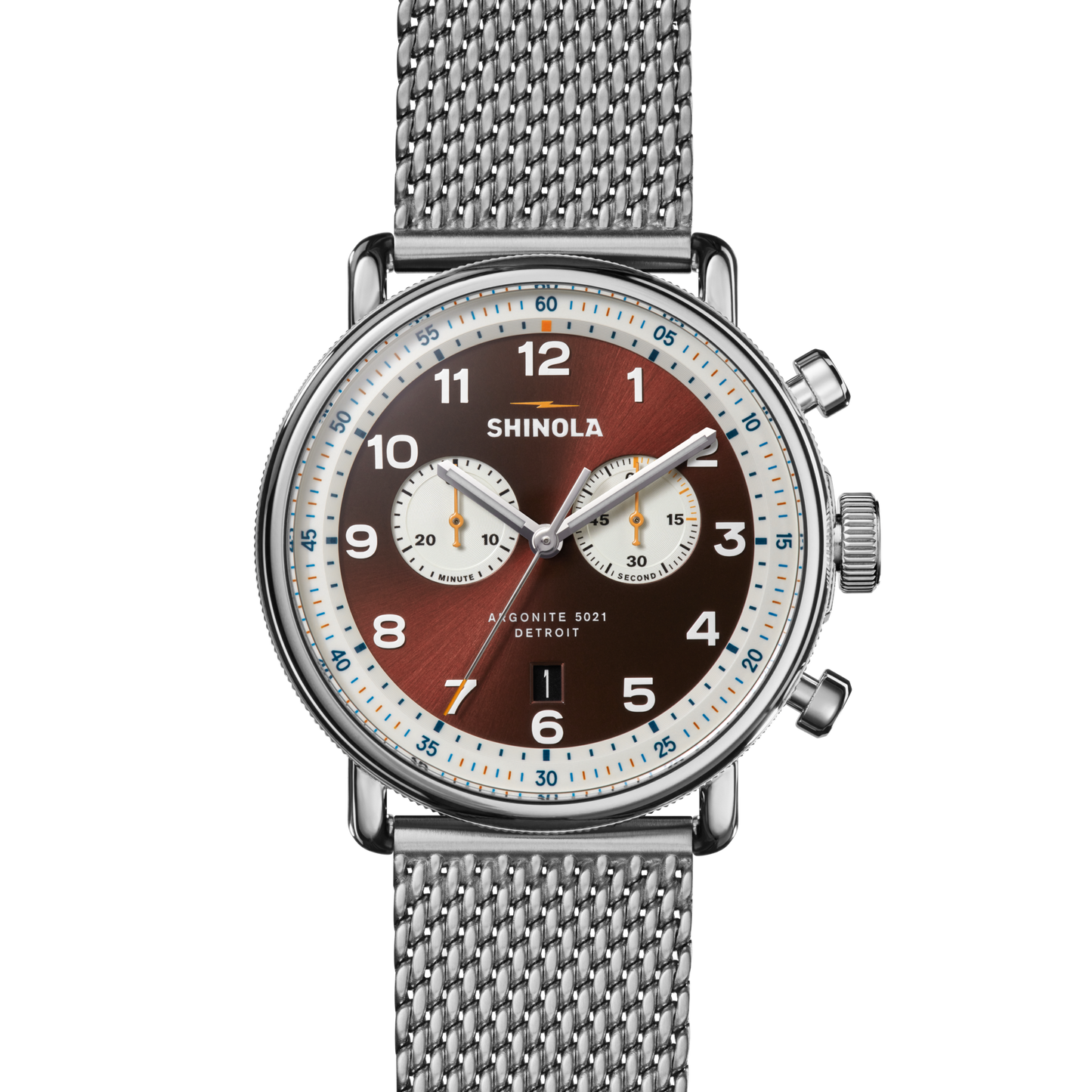 The Shinola Canfield C56 Chronograph Watch - Whiskey features a stainless steel mesh bracelet, brown dial with two white subdials and numerals, and “Shinola” plus “Argonite 5021 Detroit” on the face for a mid-century modern style.