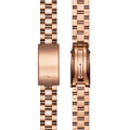 A close-up of the Shinola 14mm Rose Gold 3-Link Bracelet - PVD Rose Gold shows its detailed links and clasp mechanism, with the watch band displayed from the outside on the left and the open clasp on the right.