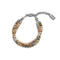 The Double Row Petoskey Beaded Bracelet by Shinola features round, earthy Petoskey stones, silver accents, a sterling silver closure, and a rectangular tag engraved with the Shinola name.