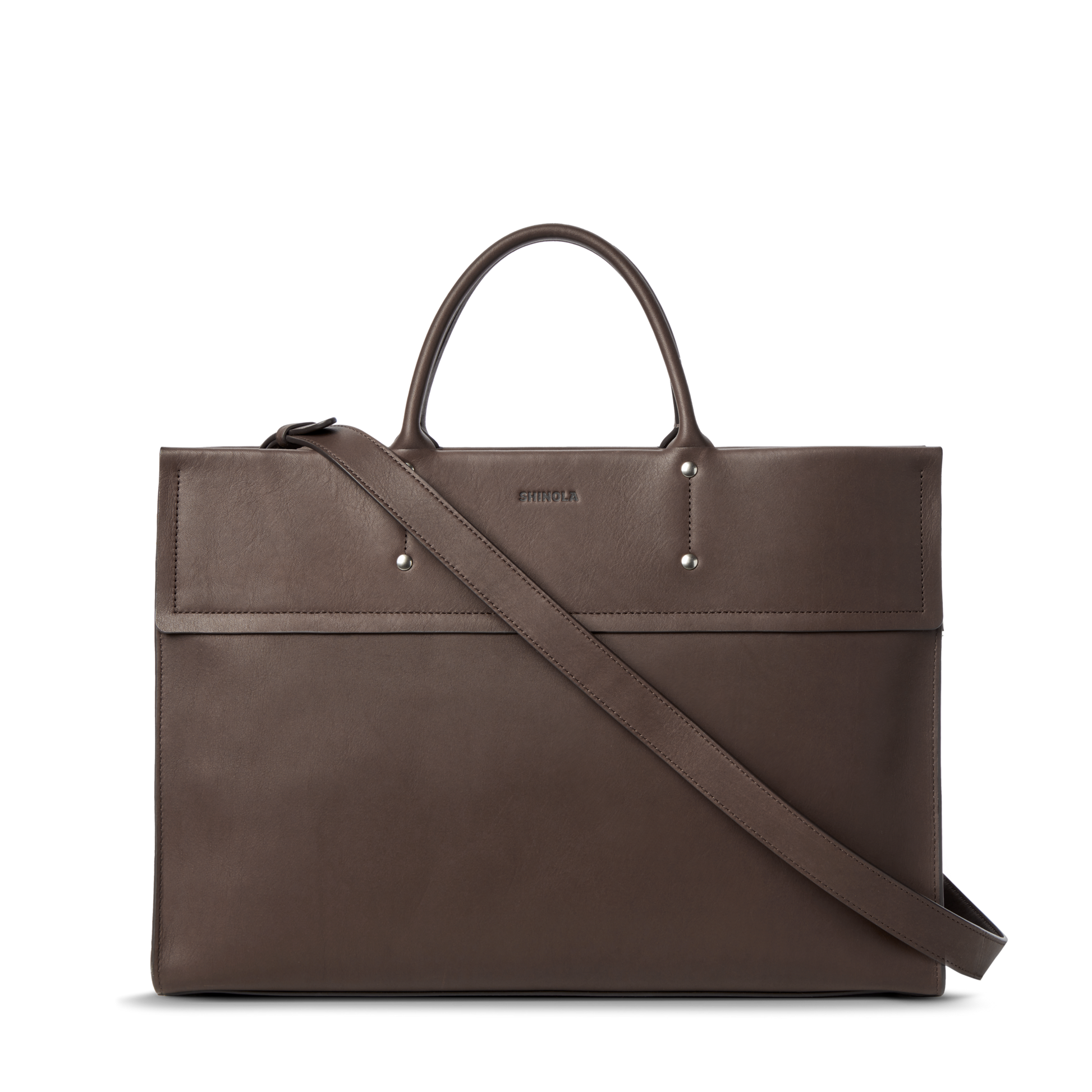 The Day Satchel - Espresso by Shinola is a brown leather laptop bag with top handles and a detachable shoulder strap, minimalist design, and subtle stitching—perfect for on the go, shown against a white background.