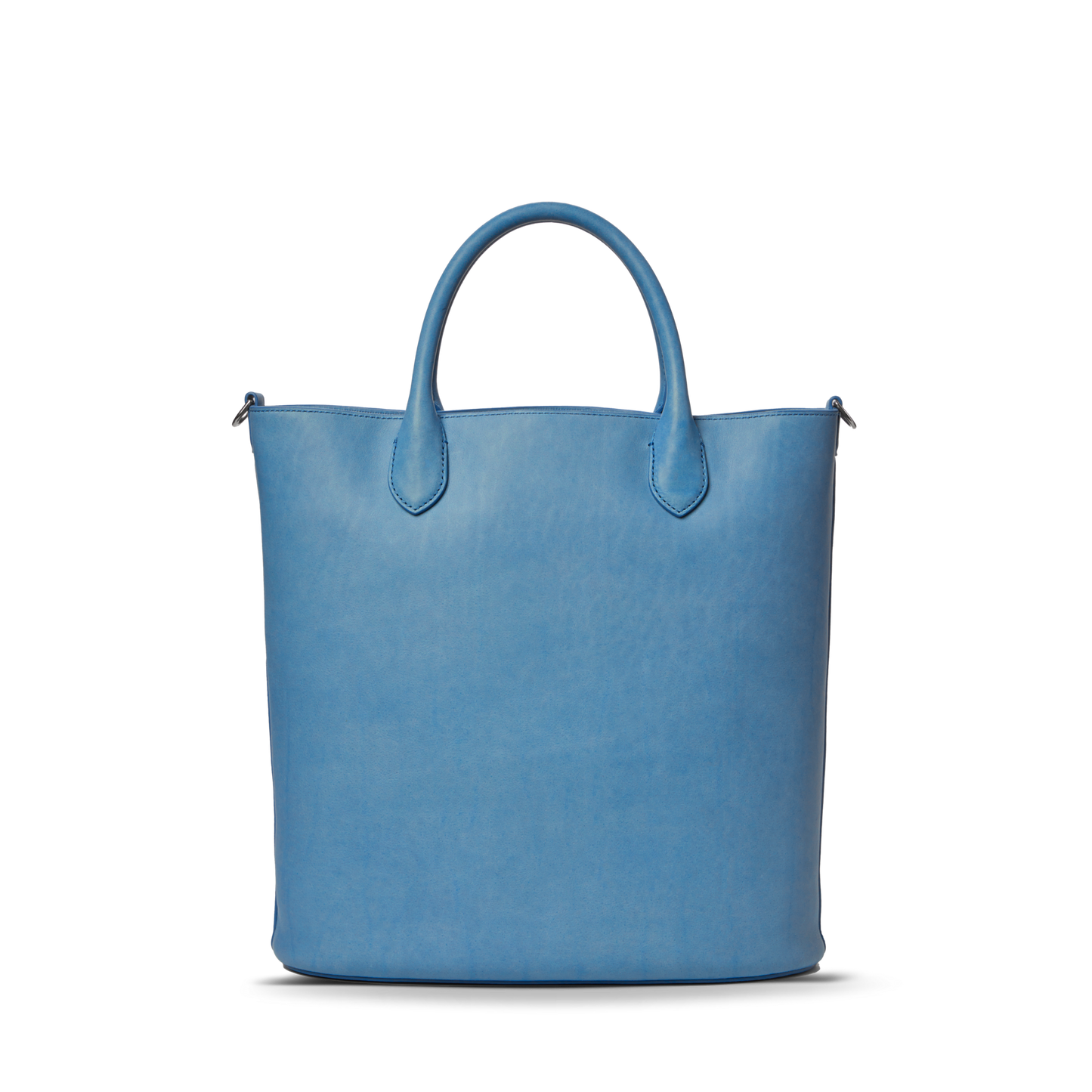 The Shinola 12 Hour Tote Bag - River is a minimalist, light blue natural leather tote with two short handles, ideal for everyday use and shown against a plain white background.