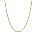 The Shinola Small Curb Link - Yellow Gold necklace is shown curved against a plain white background. This adjustable piece adds timeless elegance, making it a versatile accessory for any occasion.
