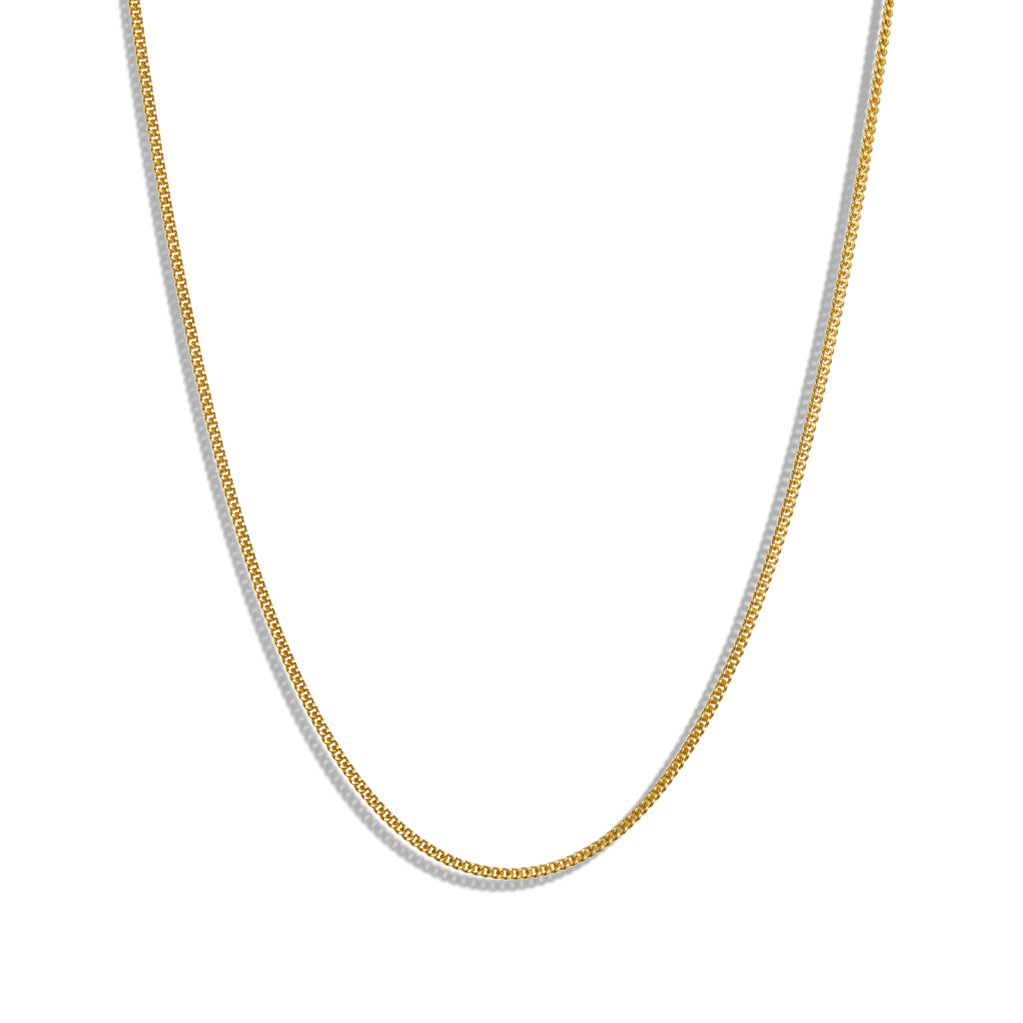 The Shinola Small Curb Link - Yellow Gold necklace is shown curved against a plain white background. This adjustable piece adds timeless elegance, making it a versatile accessory for any occasion.