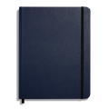 The Shinola Large Hard Ruled Journal in Navy features a closed hard linen cover, a black elastic band along the right edge, and a black ribbon bookmark visible at the bottom.