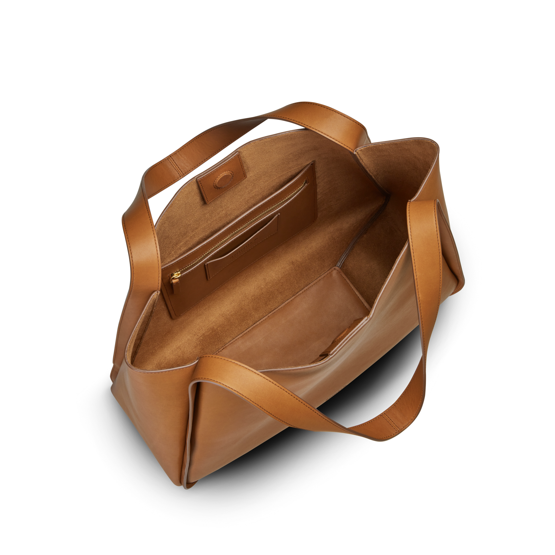 The Shinola Derby Tote Bag - Tan, crafted from natural leather, features two handles, a roomy interior with both zippered and slip pockets—ideal for everyday use and shown from above against a white background.