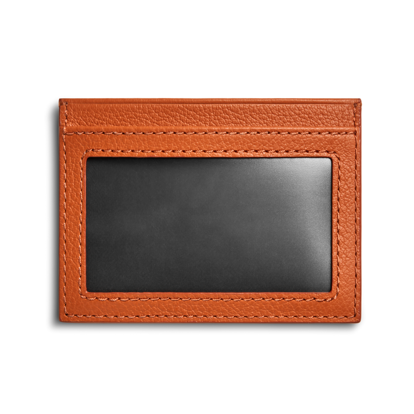 The Shinola Canfield ID Card Holder in Rust features a slim design with visible stitching, pebbled brown leather, and a transparent ID window, shown against a white background.