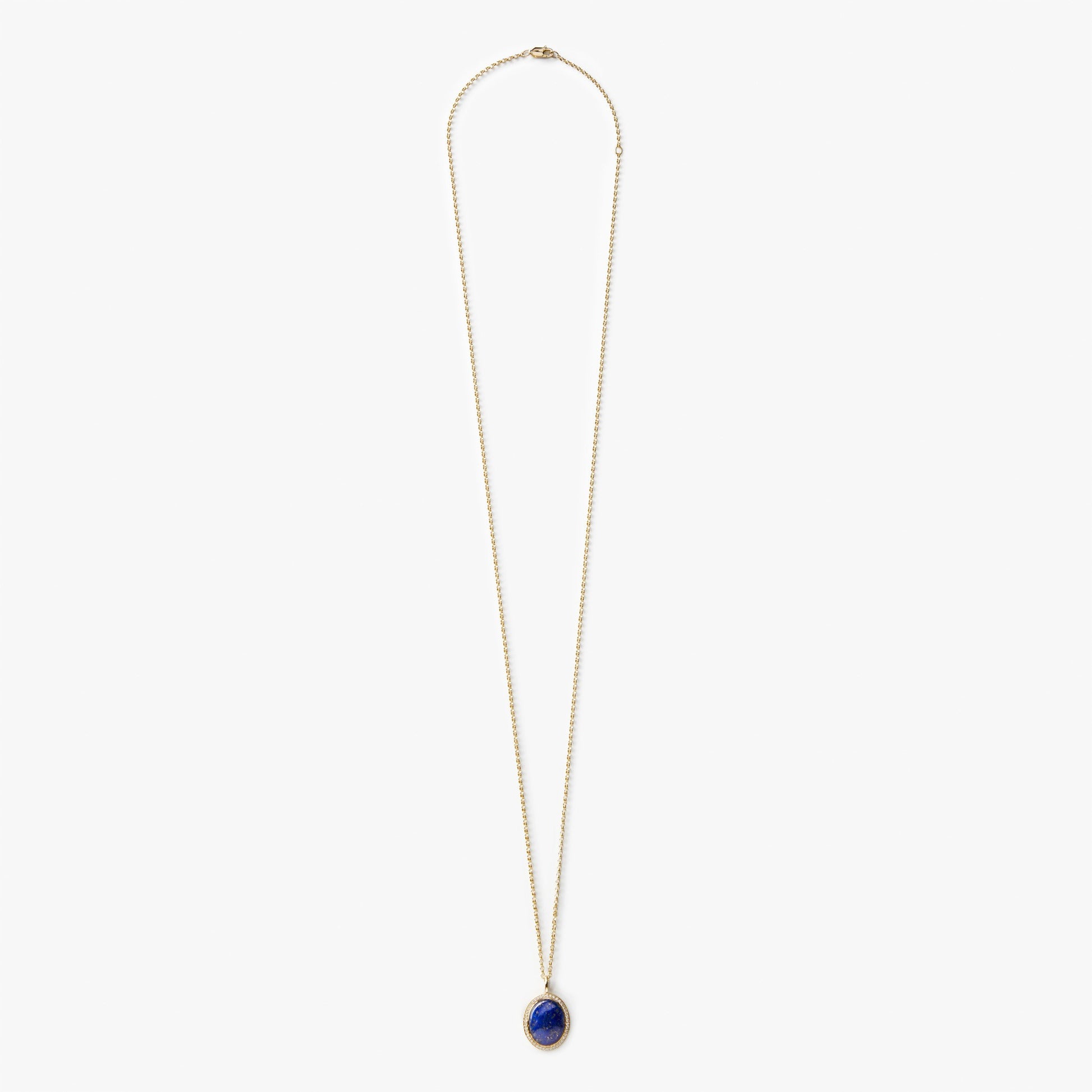 The Shinola Diamond Pave Lapis Pendant Necklace in yellow gold features a delicate chain and a small, oval-shaped blue lapis pendant with diamond accents, shown against a plain white background.