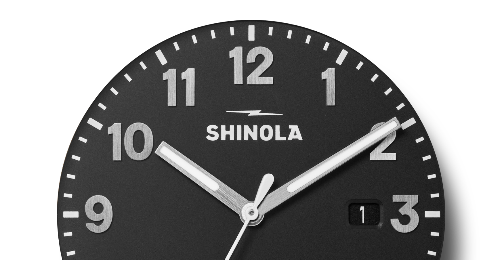 Close-up of the Shinola Detrola Watch - Black, featuring bold white numerals on a black dial with a small date window, reflecting durable construction and classic American design.